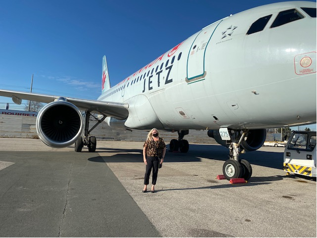 woman in front of Air Canada Jetz aircraft