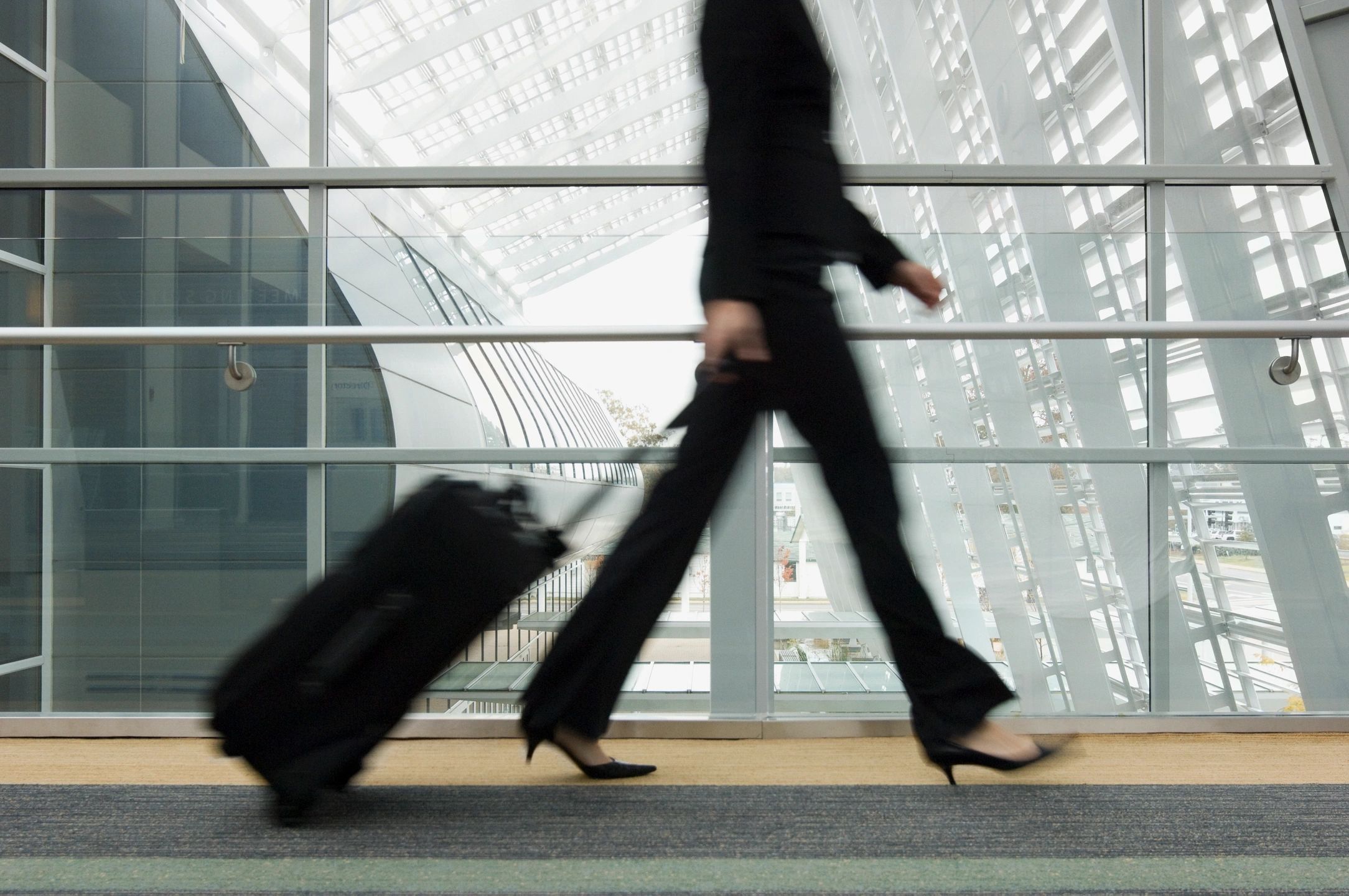 woman walking through airport