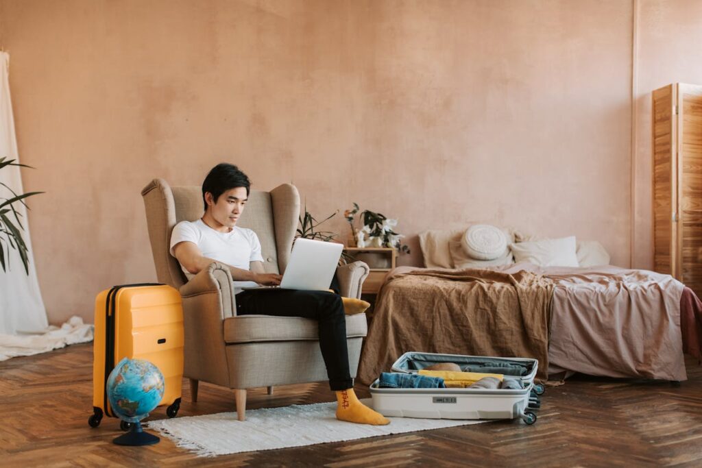 a man uses his laptop while traveling